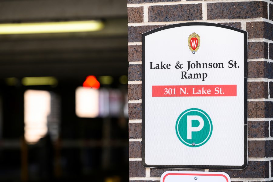 Parking lot sign fixed outside of parking ramp entrance.