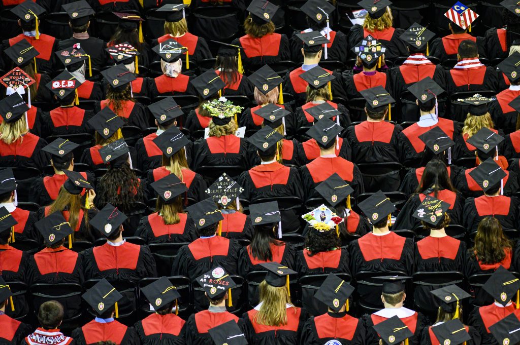 As viewed from above, UW graduates list to UW chancellor Rebecca Blank during the winter commencement ceremony held in the Kohl Center at the University of Wisconsin-Madison on Dec. 15, 2019. (Photo by Bryce Richter /UW-Madison)